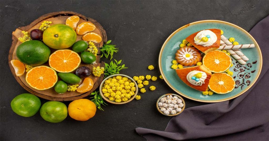 Healthy foods like carrots, spinach, fish, and eggs arranged for eye health.